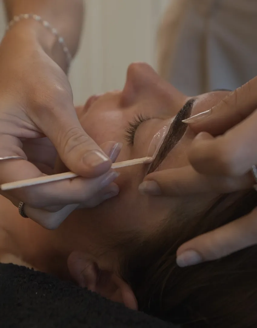 eyebrowwaxing woman getting her eyebrows waxed